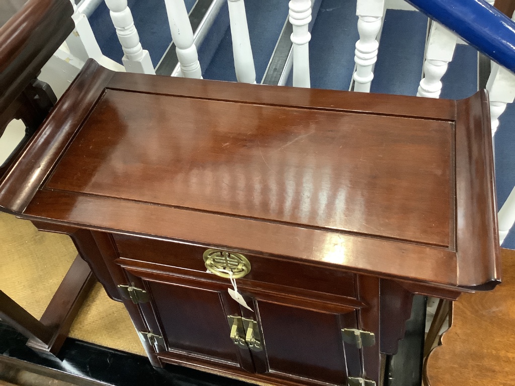 A 20th century Chinese hardwood low cabinet, with brass fitted drawer and cupboard, width 73cm depth 35cm height 72cm